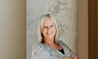 deb headshot no tilt arms up_edited.jpg