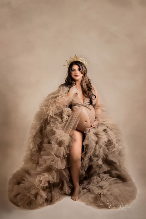 pregnant mom in champagne tulle gown