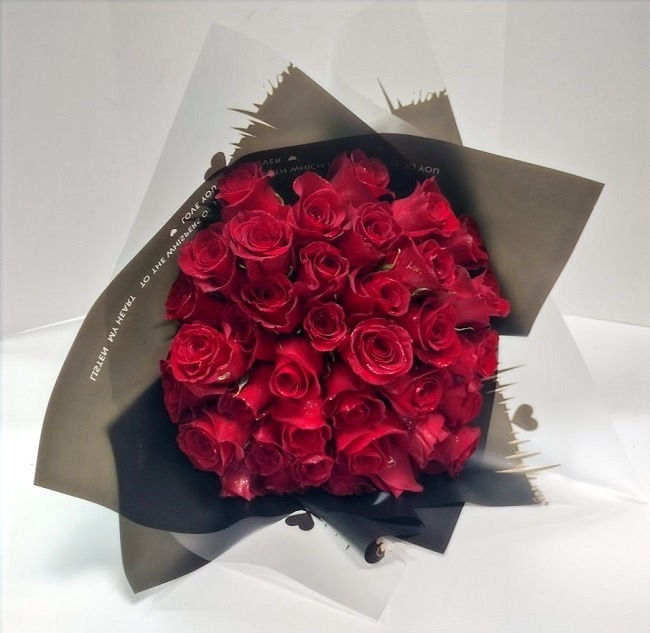 Thumbnail: Fifty long stem premium red roses, 50 red roses wrapped with paper.