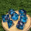 Thumbnail: Blue Liquid Core Dice Set with Red Flowers - Sharp Edge Resin