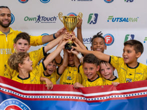 Futsal TA team celebrating with the trophy at the 2026 Joe Farrell Classic