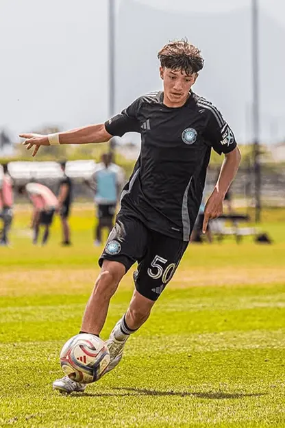 Soccer player dribbling ball