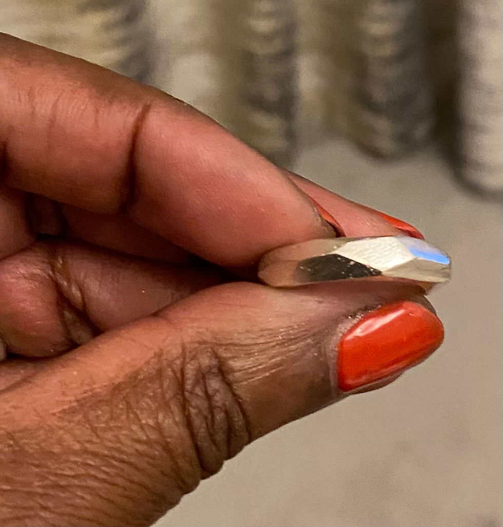 Thumbnail: Close-up of facet Ridge Ring by silver by golden showing sand cast texture and sculptural ridge design.