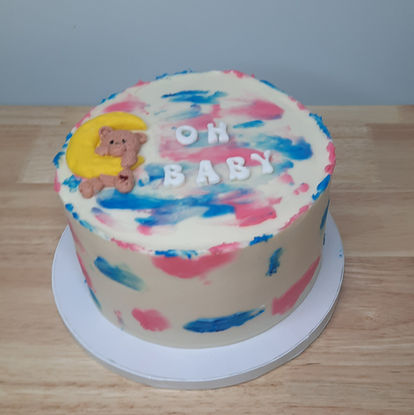 Gender reveal cake  with bear decoration.