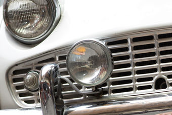 Close-up of a white classic vehicle for sale grill.
