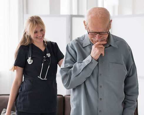 smiley-nurse-with-old-man-nursing-home.jpg
