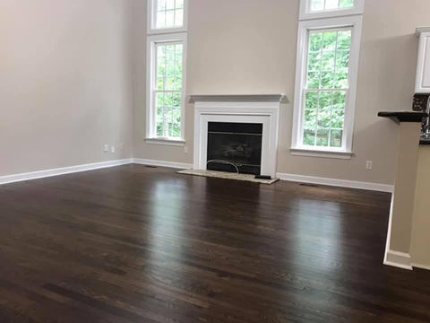 A well-maintained wooden floor in an indoor space, showcasing rich textures and warm colors that enhance the ambiance.