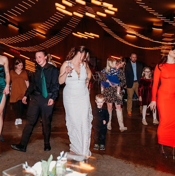 Wedding guests dancing together on the dance floor