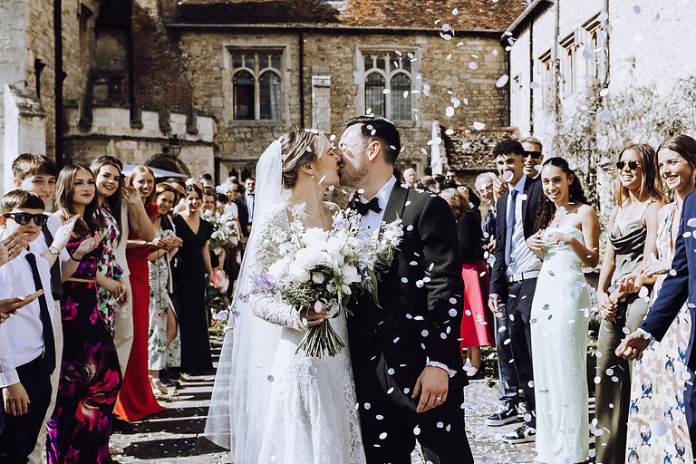 Wedding couple kissing outside Notley Abbey in Buckinghamshire