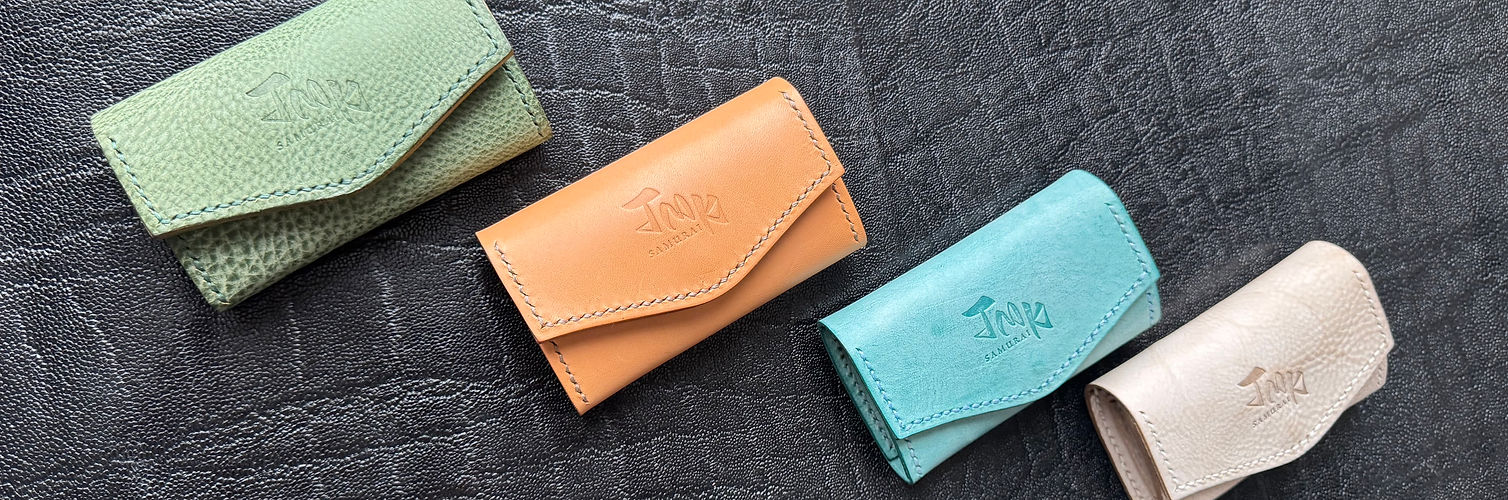High quality genuine leather coin case, diagonal angle in green, natural, ice blue and ivory