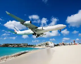 Tropical beachfront with clear skies and turquoise ocean, ideal for romantic vacations and island escapes