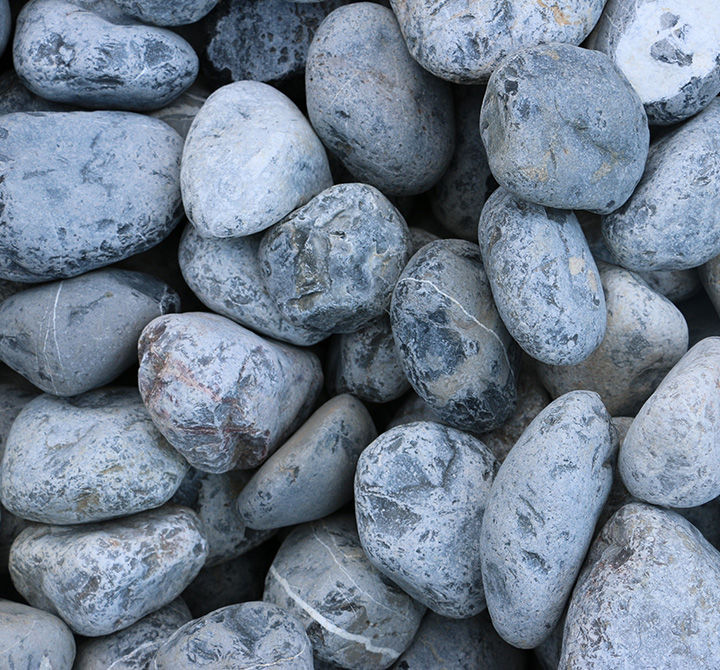 Piedras de río gris tamaño naranja.jpg
