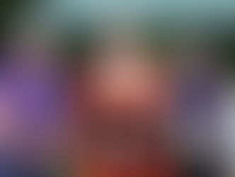 the mayor in full regalia stood with volunteers from Hillingdon stroke association who are wearing purple polo shirts reading "stroke assosiation) 