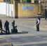 a police van can be seen with an explosives robot and specialist officers in military style uniforms