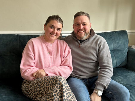 LINDA AND JONATHAN SEEN SAT ON A SOFA FIND FOSTER CARING EXTREMELY REWARDING | MAGE: LBH