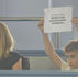 a young boy holding a sign saying "protect our school's work experience"