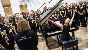 Christa playing piano as Rock Choir celebrates final note