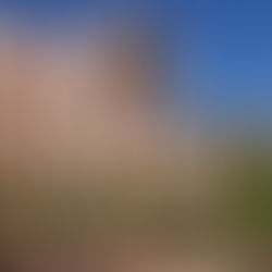 The iconic National Center for Atmospheric Research (NCAR) Mesa Laboratory in Boulder, Colorado. Designed by architect I.M. Pei, the modernist pink-sandstone towers are shown nestled against the rugged Flatirons of the Rocky Mountains.