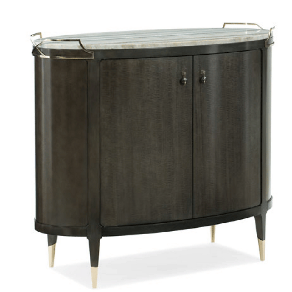 Contemporary oval-shaped bar cabinet featuring smooth lines and metallic accents, ideal for a chic and modern living space.
