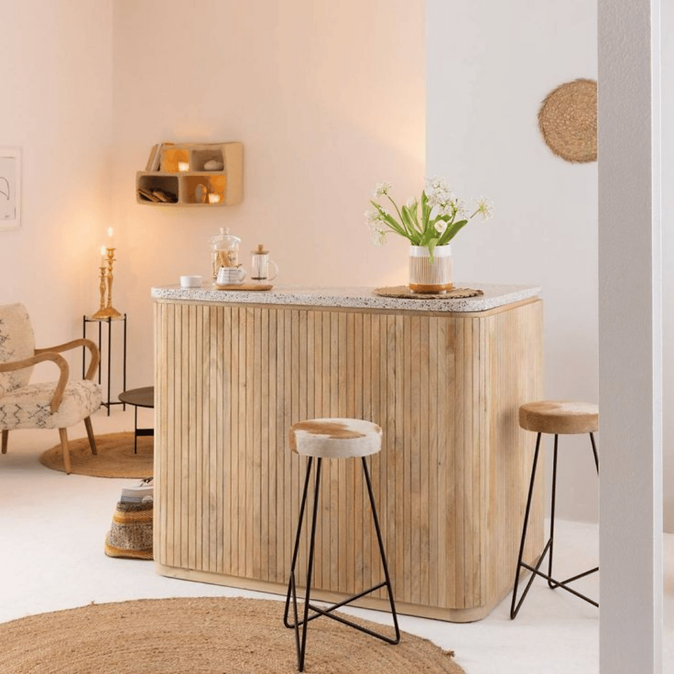 Elegant Soleil Coastal Bar Cabinet with natural wood finish, featuring a sunburst design on the doors, spacious storage for bottles and glassware, and brass accents, perfect for adding a touch of coastal charm to any home.
