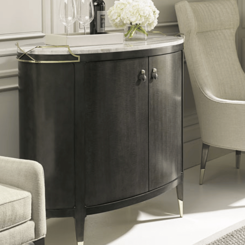 Sleek modern oval bar cabinet with a minimalist design and elegant wood finish, perfect for stylish home bar storage.