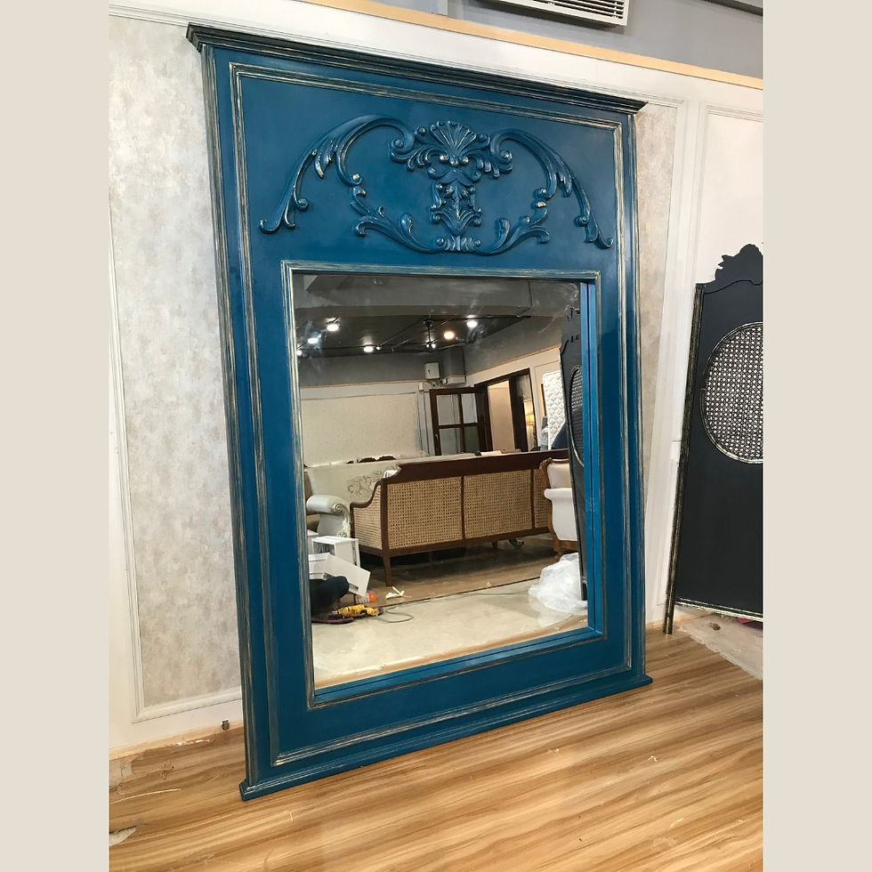 Azure Empress Mirror with a bold blue frame and ornate detailing, exuding a regal charm and adding a luxurious accent to any space.