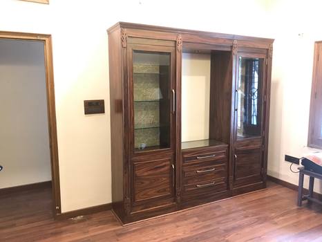 Stylish crockery cabinet with ample storage and a luxurious finish, enhancing the beauty of the dining space.