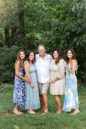 Grandpa surrounded by children during a family reunion photo session in Branson.