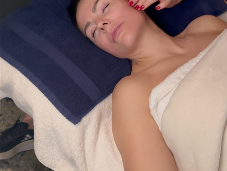 Caitlin performing Kobido facial massage technique at Connected Chiropractic Paisley