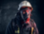close-up-portrait-of-a-firefighter-in-safety-helmet-and-oxygen-mask-studio-photo-against-a
