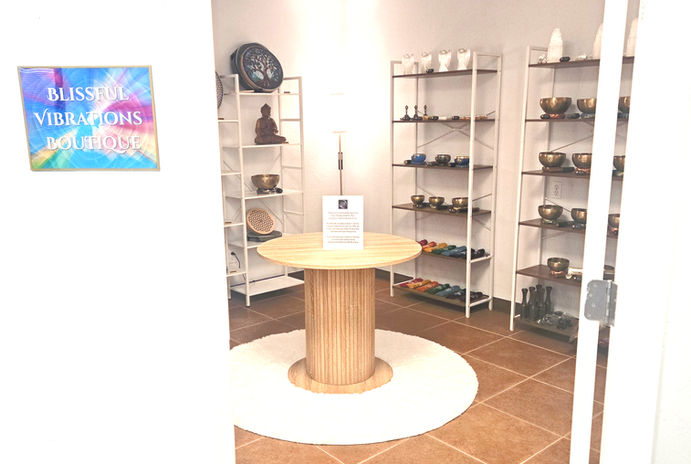 View into Blissful Vibrations showing table and sound healing instruments