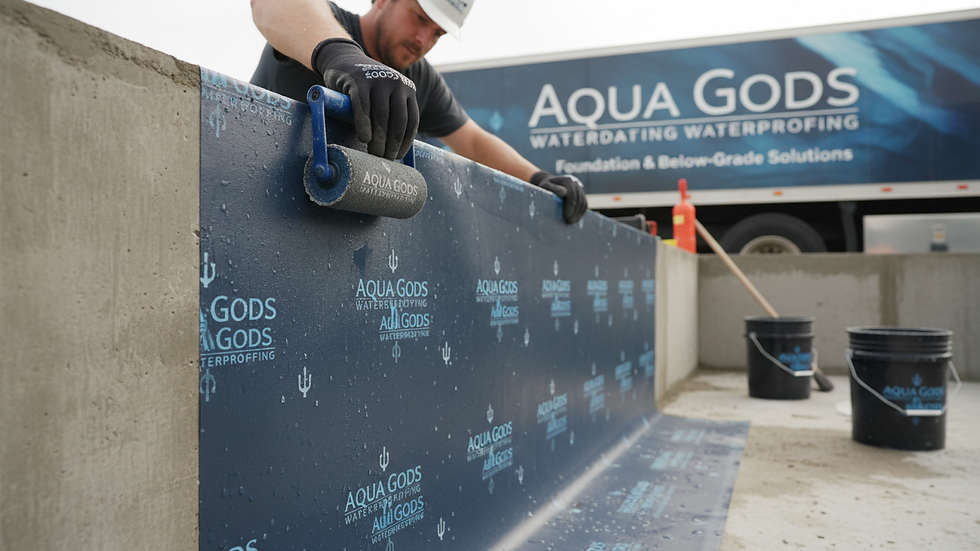 Close-up view of waterproofing membrane being applied to a foundation wall