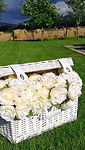 White wicker basket with peony flower po