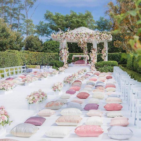 Close-up view of a traditional Sikh wedding mandap decorated with flowers