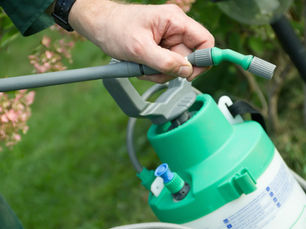 Farmer spreading pesticide