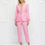 Thumbnail: Two-piece Pink Suit, Accessorized with Feathers, Pearl Lapels and Tapered Pants