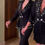 Thumbnail: Black blazer-dress, crystal-embellished cuffs, and short skirt with fringe
