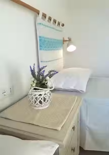  Fresh details in the twin room at Villa Agata, like lavender and ceramic touches in Sardinian style.