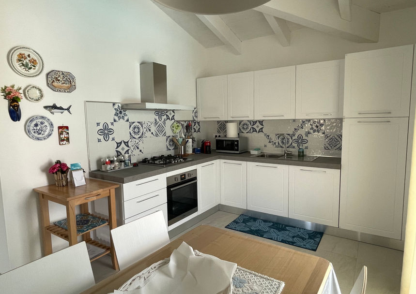 Fully equipped kitchen at Villa Agata with oven, cooktop, and everything you need to prepare meals.