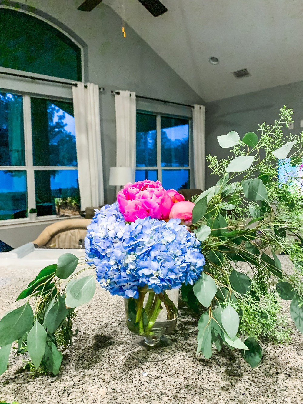 blue hydrangeas, pink peonies, eucalyptus flower arrangement