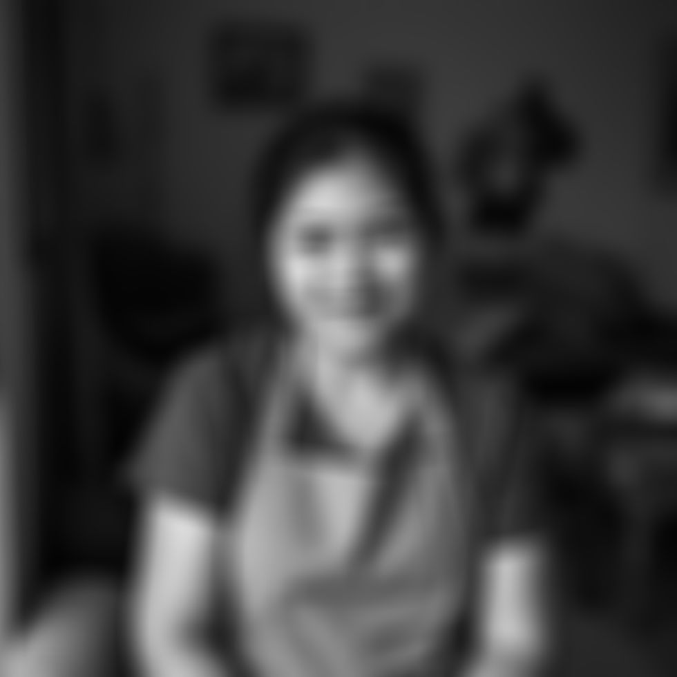 a filipina woman in her thirties, she works as a caregiver for the elderly.jpg