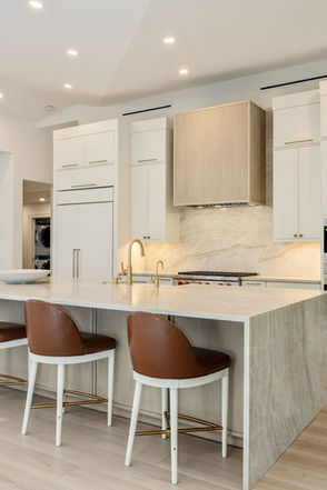 Kitchen island remodel with white marble counters at 6141 Bur Oaks Ln, Naples, FL 34119 - Ryan & Voigt Contracting
