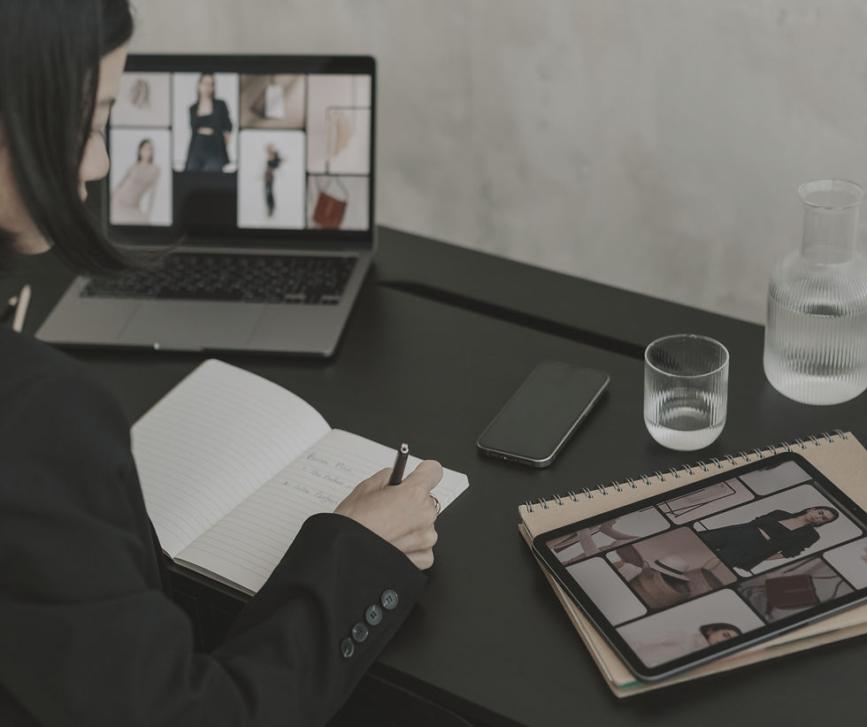 Woman working at laptop and drinking coffee
