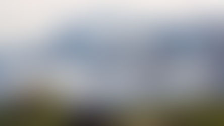 Tall mountains with low hanging clouds 