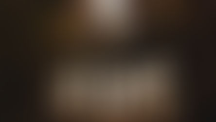 A forest at night with large HOPE letters lit up