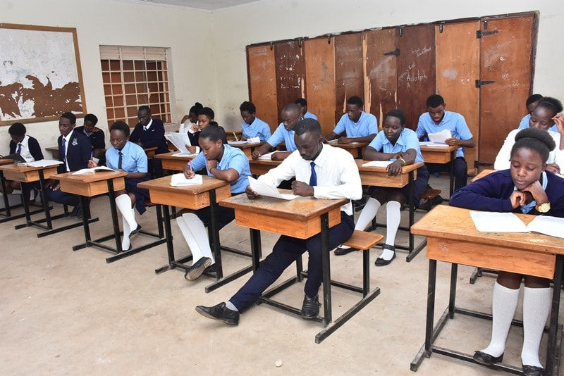 Students at Emma High School during an examination, Emma High School, Examination hall, Students at Emma High School, Classroom, Students in an examination, Ugandan students in an examination session