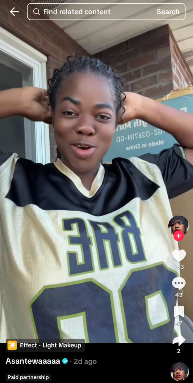 Ghanaian TikToker Asantewaaa dressed in a buggy baseball jersey