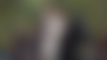 Caitriona Balfe, Sam Heughan, and Grant O'Rourke appear on horseback in a scenic Scottish highland setting from the Outlander series, photographed by Ed Miller for Sony Pictures Television.