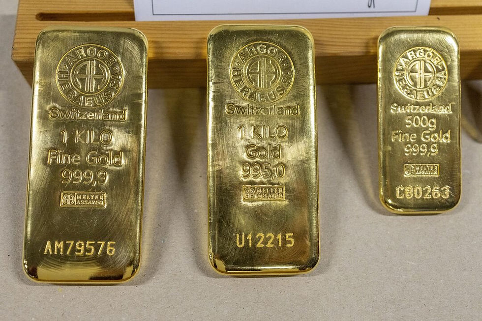 Close-up display of Swiss Argor-Heraeus gold bars, including two 1-kilogram fine gold bars (999.9 and 995.0 fineness) and one 500-gram bar, representing the physical bullion central banks are accumulating as part of the new global reserve order.