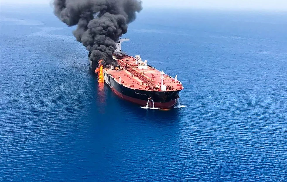 This image captures the Front Altair oil tanker engulfed in flames and heavy black smoke during the June 2019 Gulf of Oman incident. The event heightened global energy supply concerns and geopolitical tensions between the U.S. and Iran.